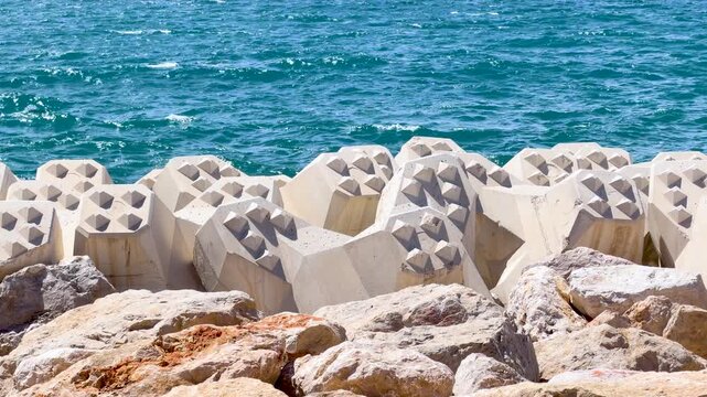 Concrete Tetrapod Breakwater and Rocks Along the Cannes Shoreline