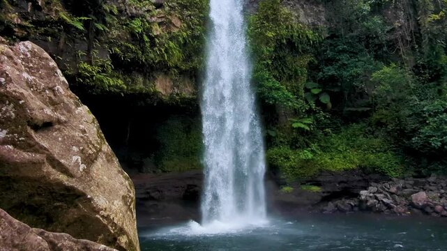 Scenic pan down Tavoro Waterfall at Bouma National Heritage Park on Taveuni Island, Fiji in South Pacific