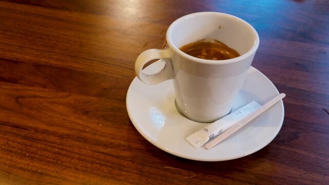 White Ceramic Cup of Espresso on a Wooden Bistro Table