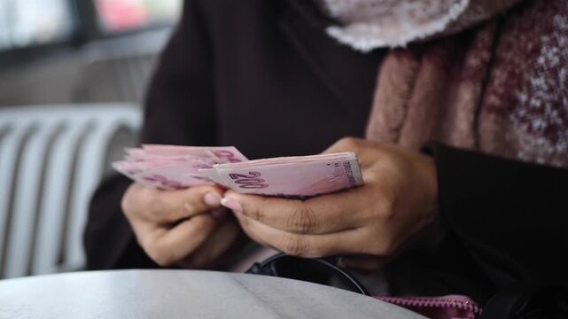Counting money in a cafe during afternoon hours. turkish lira counting