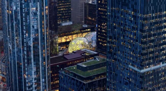 7th of February 2026 Drone flight above the Seattle downtown skyline with Amazon Spheres and modern office towers at blue hour, Washington USA. g.