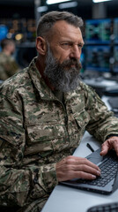 Fototapeta premium Veteran soldier concentrating on laptop 