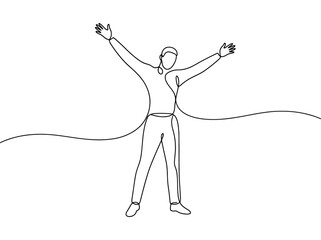 Fototapeta premium A happy person with arms raised celebrating victory while standing in an open field
