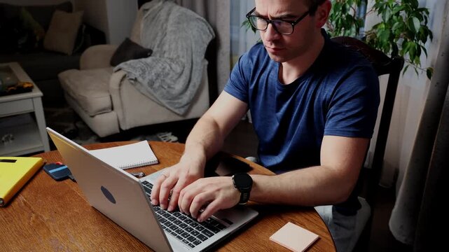 Freelancer works at home office on laptop while managing tasks and maintaining productivity throughout the day