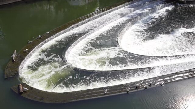 Bath, UK - May 12, 2026: Flow of Avon River and North Parade Bridge in Bath in England