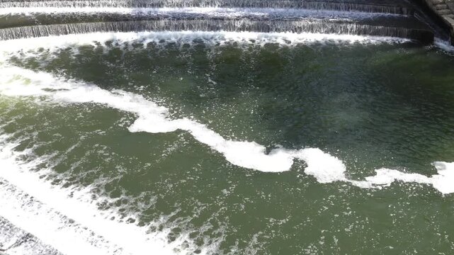 Bath, UK - May 12, 2026: Flow of Avon River and North Parade Bridge in Bath in England
