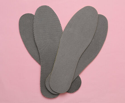 Insoles on a pink background. Top view