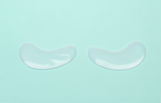 Eye patches on blue background. Beauty concept