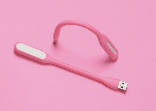 Flexible USB lamps on pink background. Top view