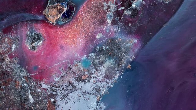 Ethereal top-down macro of purple and teal alcohol inks blending into a soft galaxy pattern, evoking a dreamlike and calm atmospheric mood.