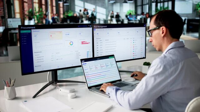Project Manager Reviewing OKR Progress Dashboard On Laptop