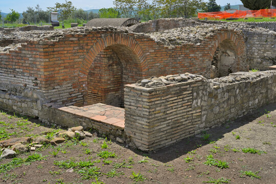 Roman ruins showing ancient brick walls and arches in Venosa. Basilicata, Italy