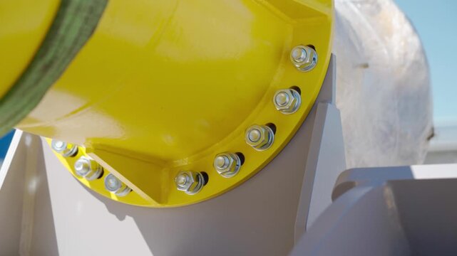 Close-up of large industrial venturi tube with flanged end, with several bolt holes around the circumference. Equipment maintenance manufacturing plant factory oil and gas metal pipe. Petrochemical.