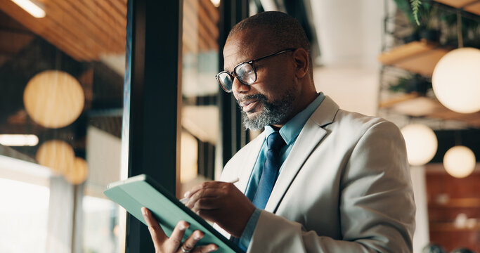 Businessman, glasses and research with tablet in cafe, private wealth attorney and will draft on web. Black person, estate planning and mature lawyer with tech for project or remote work in office