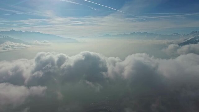 aerial view of the clouds Dramatic Aerial View Of White Puffy Clouds Under A Bright Blue Sky in Sunny Weather Aerial shot of flying over a layer of soft clouds at dawn