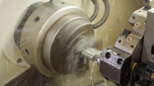 Lathe industrial turning machine operation. Cnc milling machine in operation with metal gear. Precision alignment ensures secure clamping.