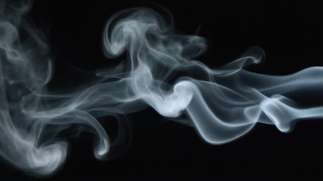 White smoke wisps flowing slowly against black background. Ethereal vapor clouds moving horizontally. Abstract smoke patterns for cinematic video overlays and creative motion design backgrounds.