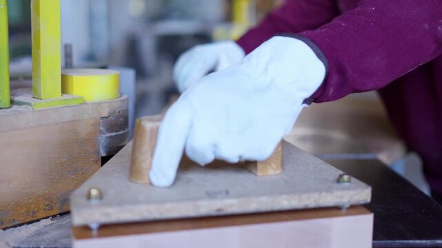 Woodworking machine shaping wooden board in workshop