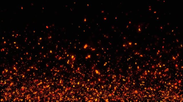Fire embers and glowing sparks rising vertically against black background. Cinematic particle effects for video overlays. Heat and flame elements for movie production and graphic design.