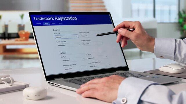 Man Filling Trademark Registration Form Online