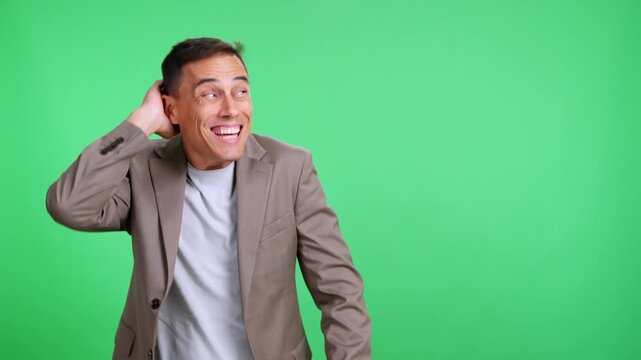 Shy man feeling embarrassed on green screen