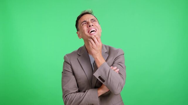 Businessman thinking and having a brilliant idea on a green screen