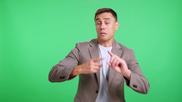Man counting on fingers and celebrating against a green screen
