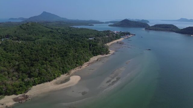 Drone footage capturing remote Koh Jum island scenery in Krabi Thailand with tropical islands calm bay waters lush vegetation and a hidden coastal village. Remote Hidden Gem in southern Thailand.