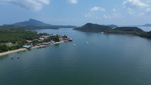 Drone footage capturing remote Koh Jum island scenery in Krabi Thailand with tropical islands calm bay waters lush vegetation and a hidden coastal village. Remote Hidden Gem in southern Thailand.