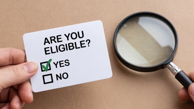 Hand holding card with 'ARE YOU ELIGIBLE?' question and yes checked, magnifying glass on beige background