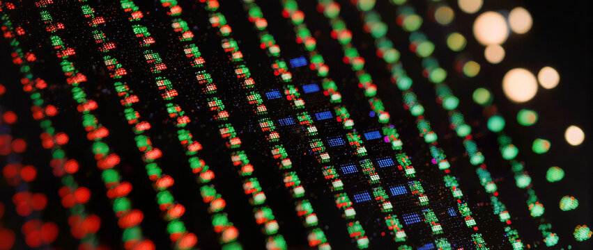 Cinematic display subpixel macro detail with red green blue dots and warm bokeh light, abstract pixel technology pattern, editorial B2B background with copy space