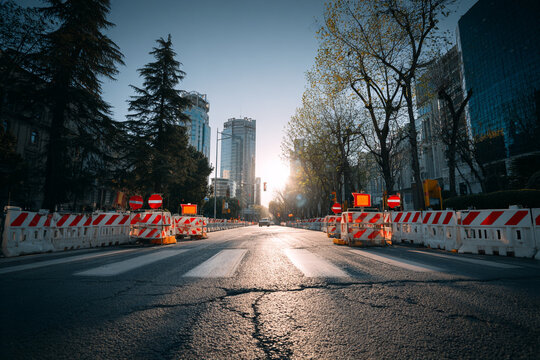 City street, road construction, blocked road, urban landscape, traffic barriers