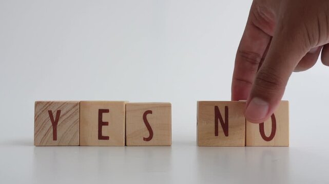 The concept of YES or NO decision-making written on wooden blocks. Business decisions. Having an opinion about something.