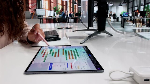 Project Manager Reviews Detailed Gantt Chart Schedule