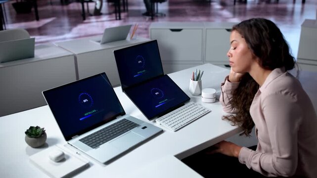 Person Updating Laptop Software While Waiting For Slow System Install