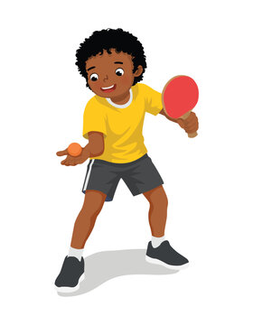 Little African boy playing table tennis in serving position ready to strike the ping pong ball with paddle
