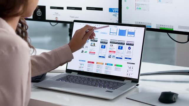 UX Designer Carefully Reviews App Interface