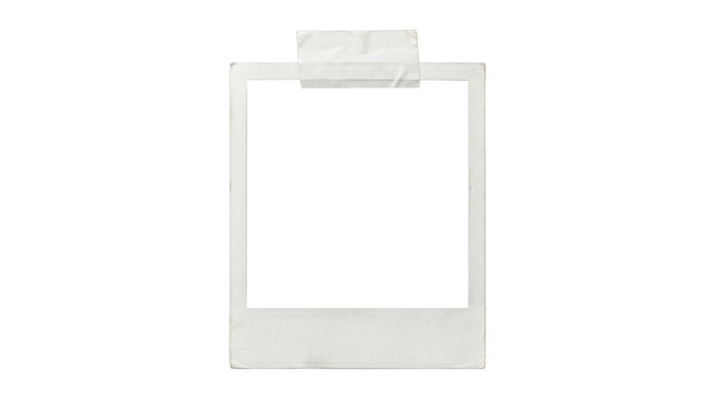 A blank white polaroid photo frame with tape on top isolated on transparent background