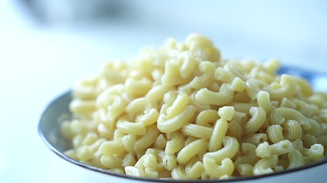 Soft boiled macaroni pasta served, ready for a simple and satisfying meal.