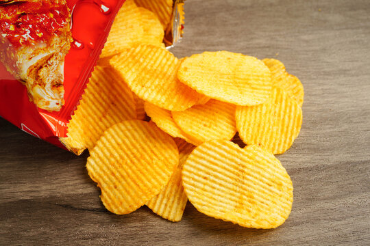 Potato chips , delicious BBQ seasoning spicy for crips, thin slice deep fried snack fast food.
