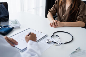 Fototapeta premium Healthcare. Doctor and patient are discussing&nbsp;interview consulting patient. Professional medical doctor in the hospital. Healthcare and medical