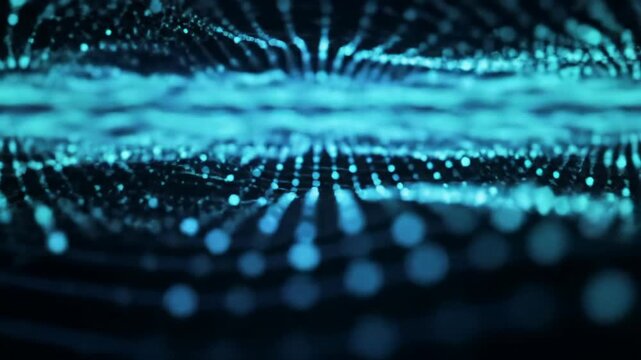 Glowing cyan and blue circular light particles flow and connect, forming intricate patterns in an abstract, futuristic digital network video with shallow depth of field. Concept of innovation and
