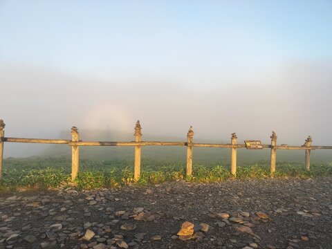 Misty Sunrise and Rainbow at Lake Mashu in Hokkaido, Japan
