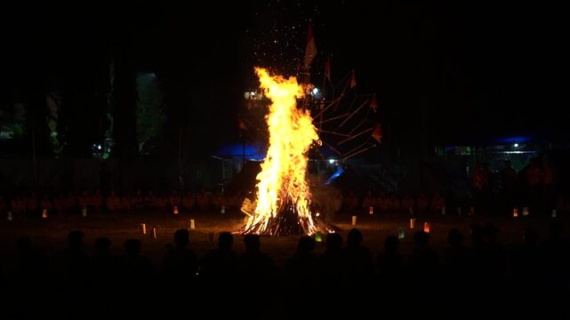 A blazing bonfire during a scout camping event in Indonesia