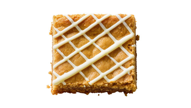 Golden brown square blondie with white icing drizzle, isolated on transparent background
