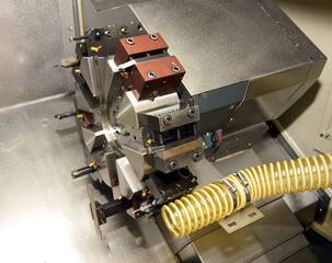 Automated metalworking machinery, CNC lathe turret head equipped with carbide inserts. © Anasia