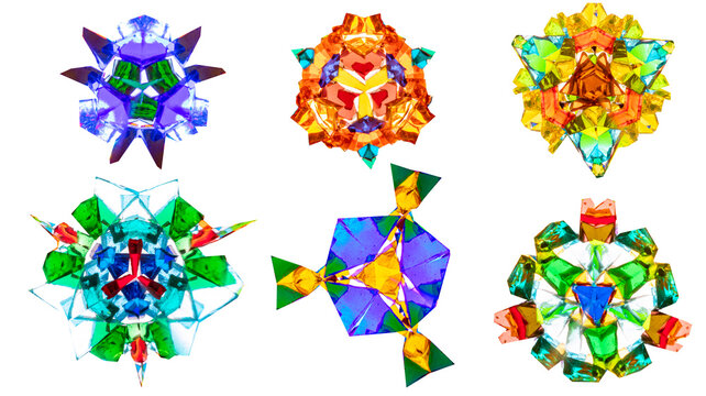Set of isolated elements of a real kaleidoscope shot on camera. Natural colorful ornaments on white background for patterns, sticker design, web graphics, presentations, crafts. (187 characters)
