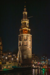 Obraz premium Amsterdam Skyline at Night Seen from the Water