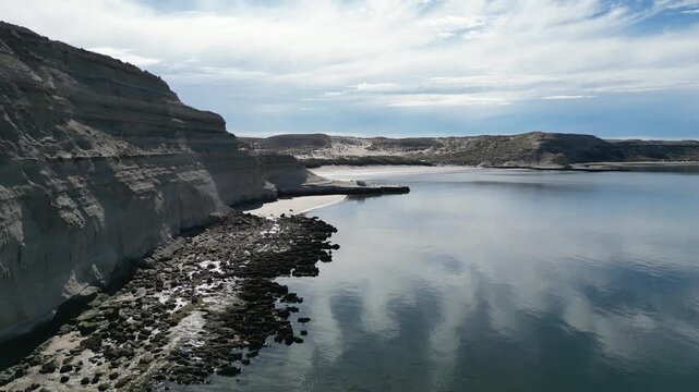 Scenic coastal cliffs and calm Atlantic bay on Valdes Peninsula near Puerto Piramides Argentina