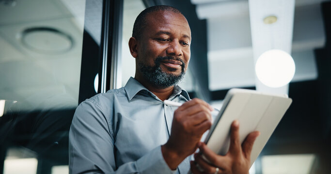 Business, black man and writing with tablet in office for research, court case and legal evidence. Smile, mature lawyer or digital for witness testimony, statement report and confidential information